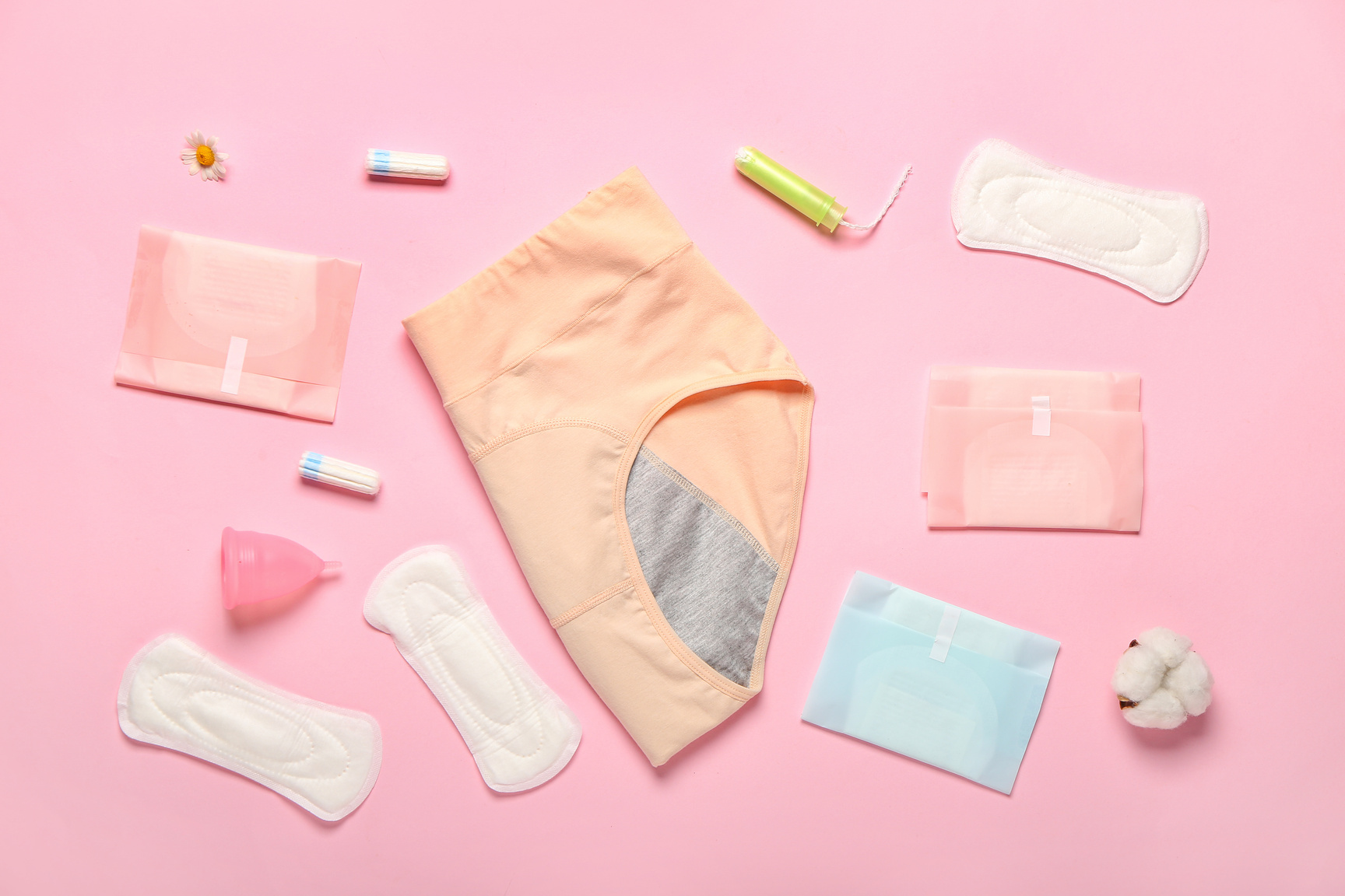 Composition with Period Panties, Pads, Menstrual Cup and Tampons on Pink Background